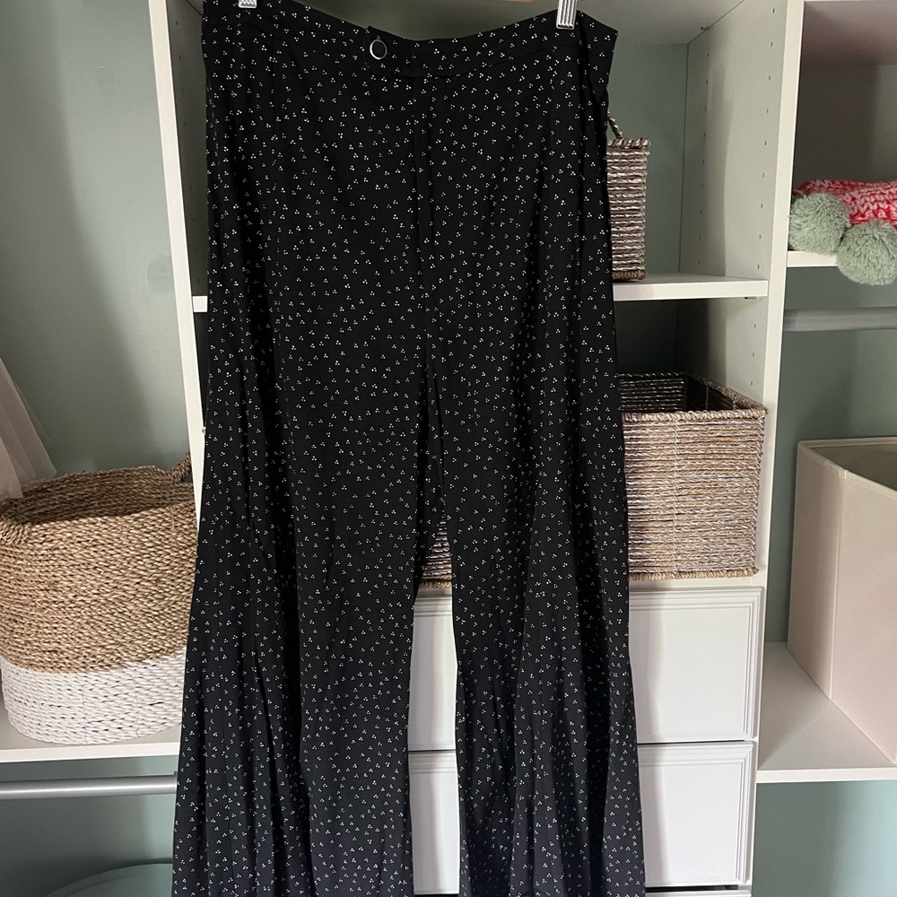 Black w white dot flare Anthropologie pant. Size 10. Zipper button closure.